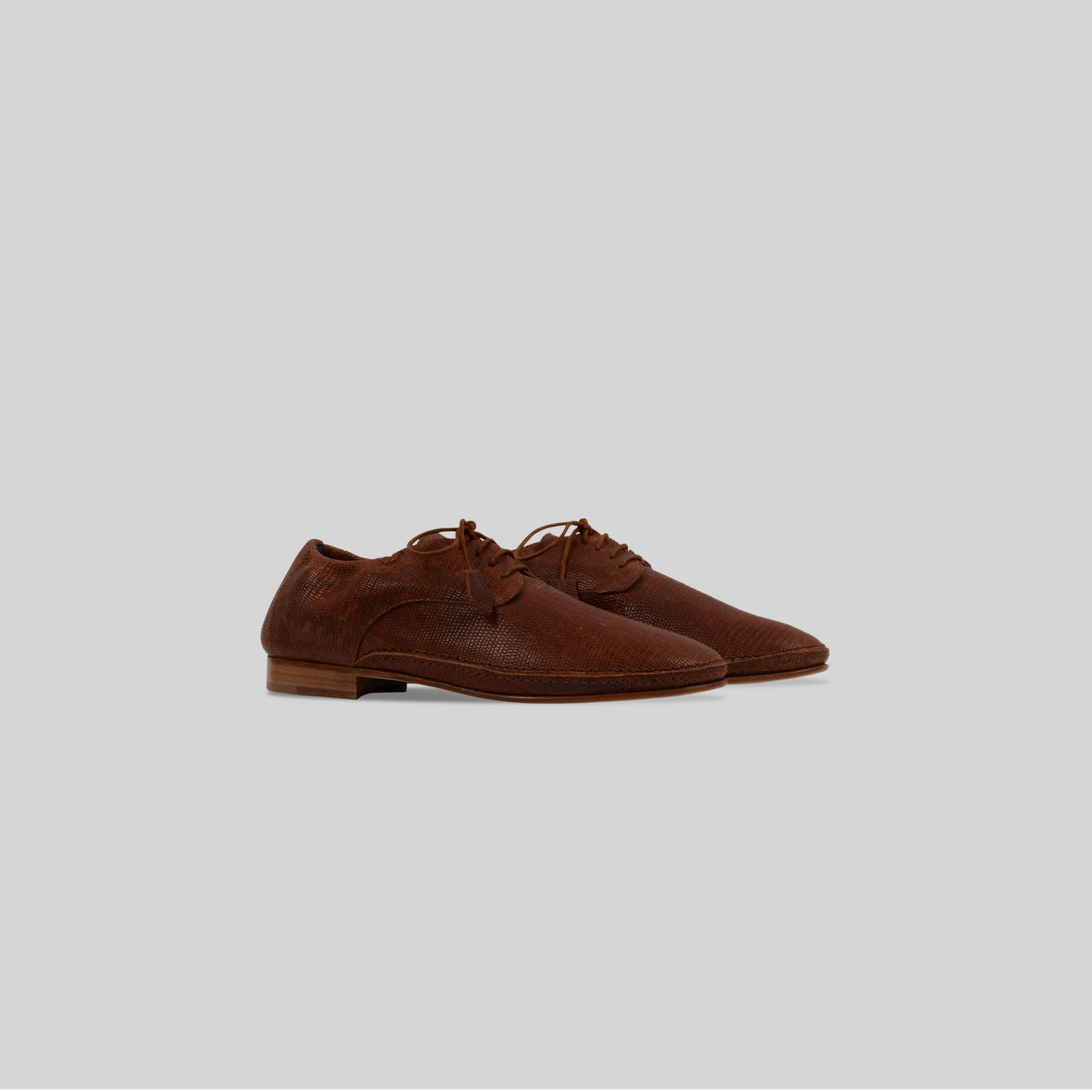 Berlino Derby shoes in embossed lizard print leather